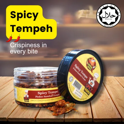 Spicy tempeh served on a plate, garnished with herbs, showcasing its golden-brown color and appetizing texture.