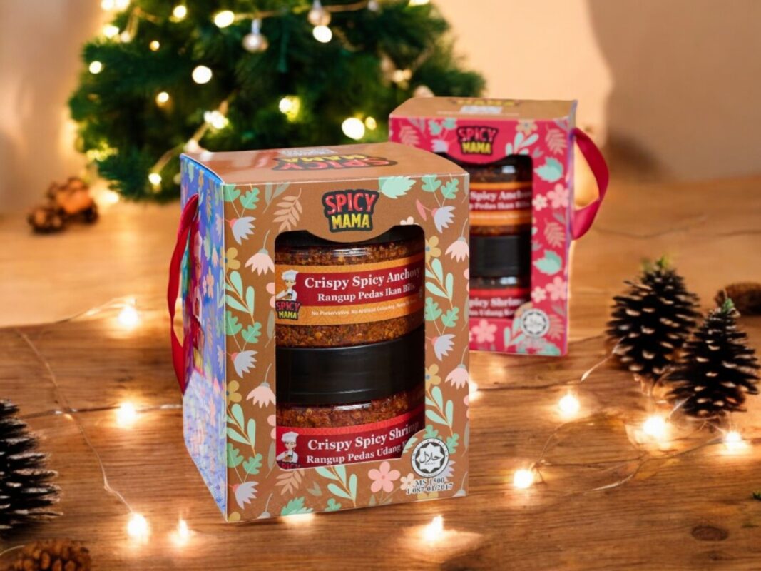 two boxes of spicy mama gift set in front of Christmas scene