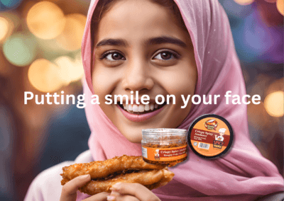 A girl wearing a hijab is holding a sandwich, smiling as she enjoys her meal in a bright, cheerful setting.