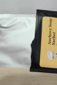 A person holding a bag SpicyMama Anchovy Soup Sachet 