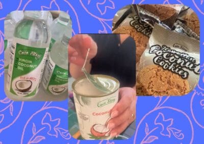 A hand displays a can of coconut milk alongside a bottle of extra virgin coconut oil, featuring Cocostory's coconut products. 